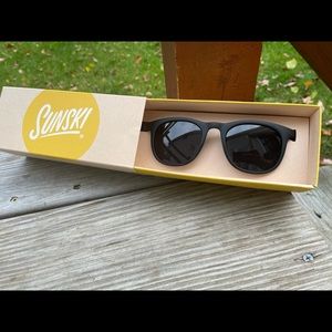 Sunski sunglasses, brand new in the box. Seacliff style, black slate color.